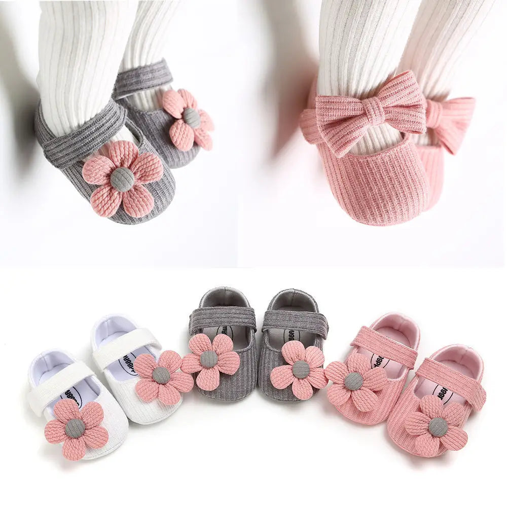 Set of baby shoes with floral designs on a white background